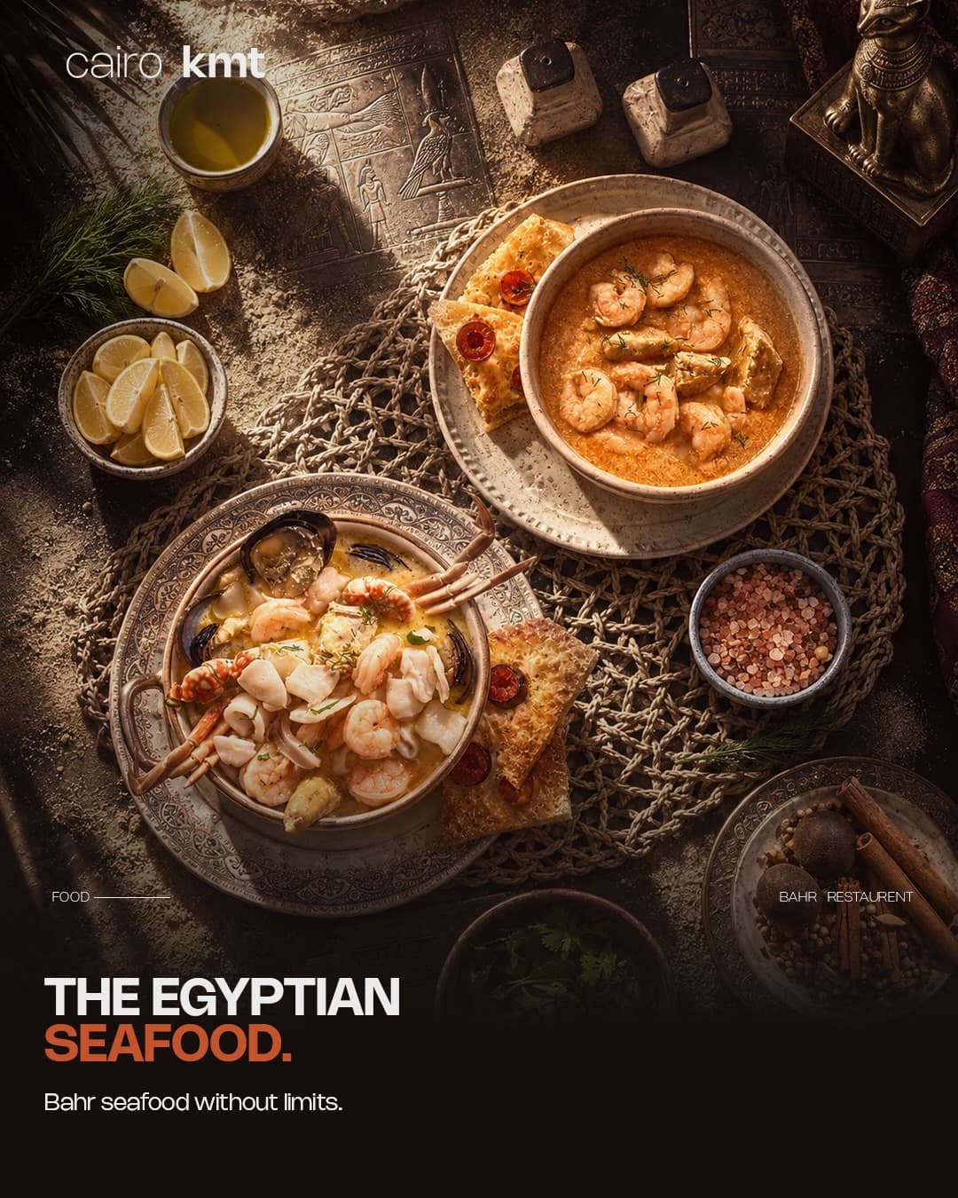 Grilled fish, shrimp tagine and a seafood pot on a table