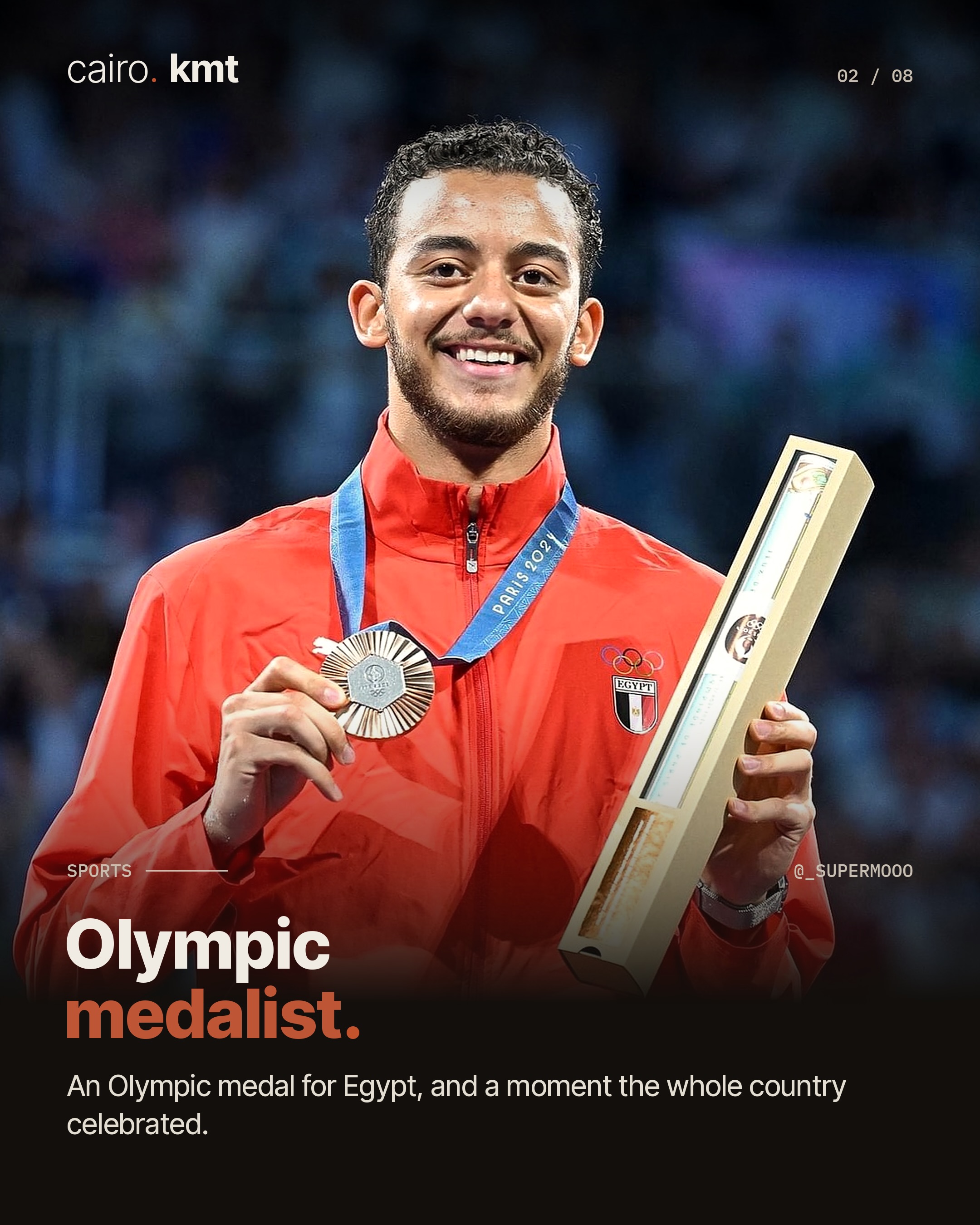 Mohamed Elsayed celebrating on the piste in fencing whites