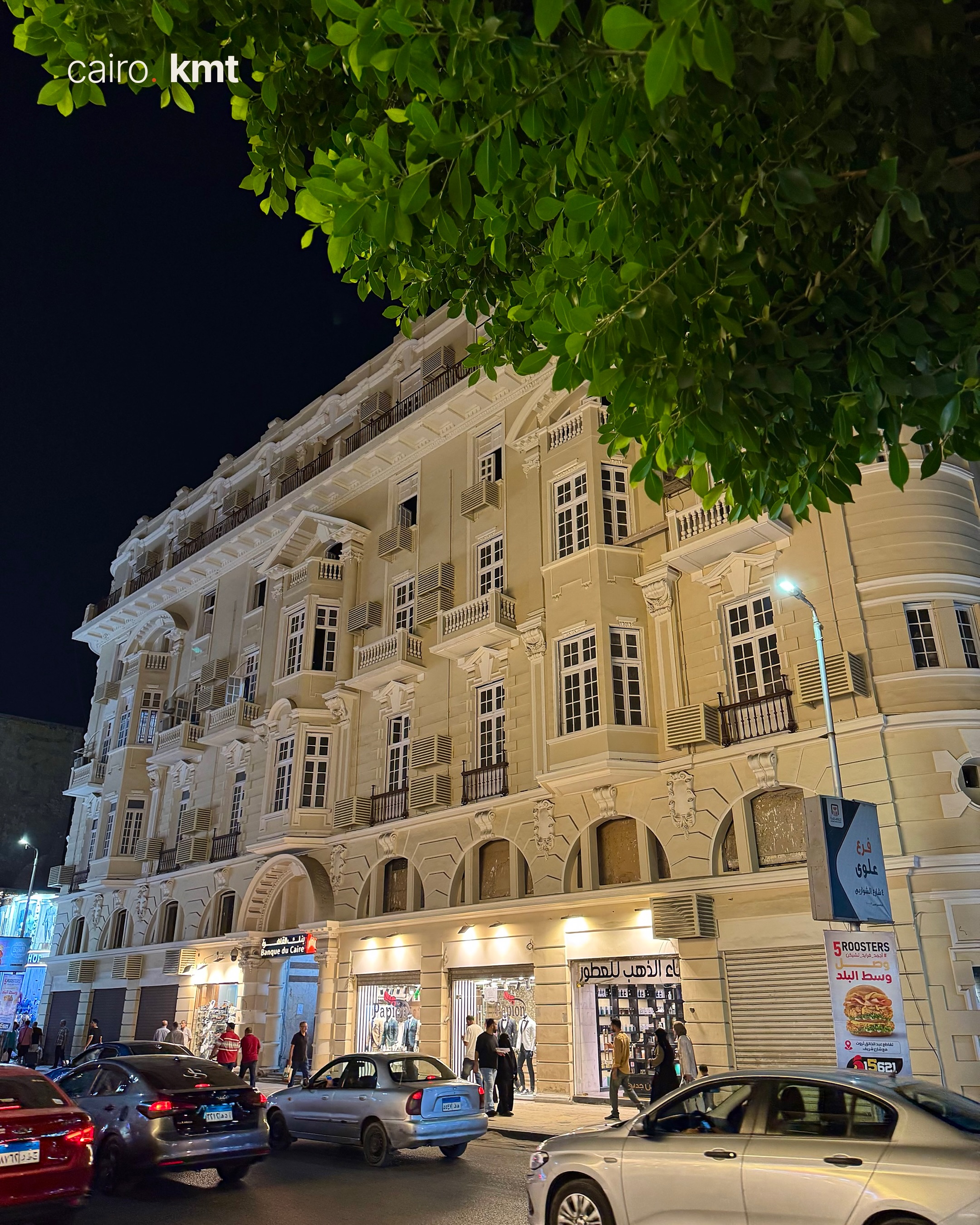A lit Khedival-era building in Downtown Cairo at night