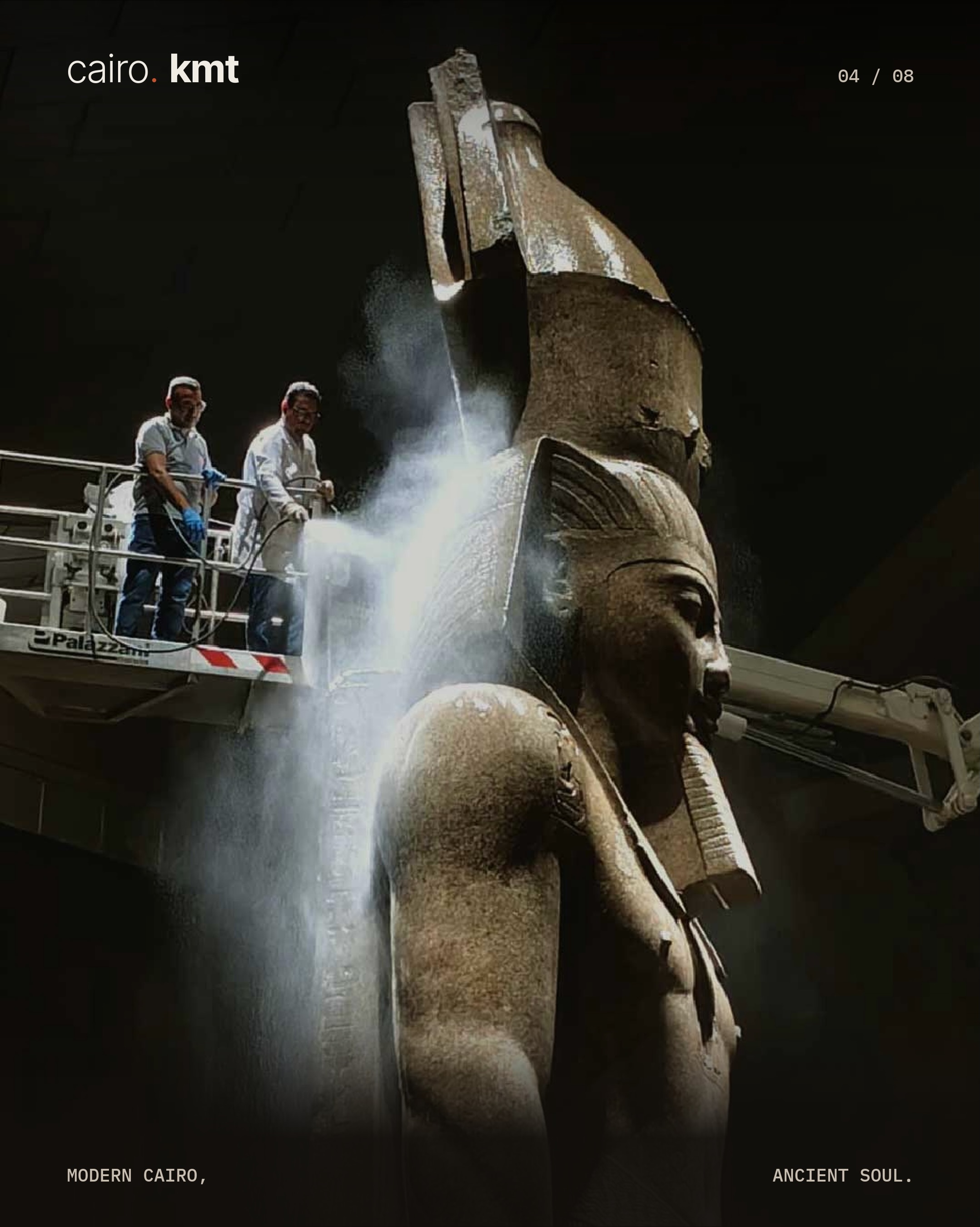 A conservator cleans the colossal statue of Ramesses II