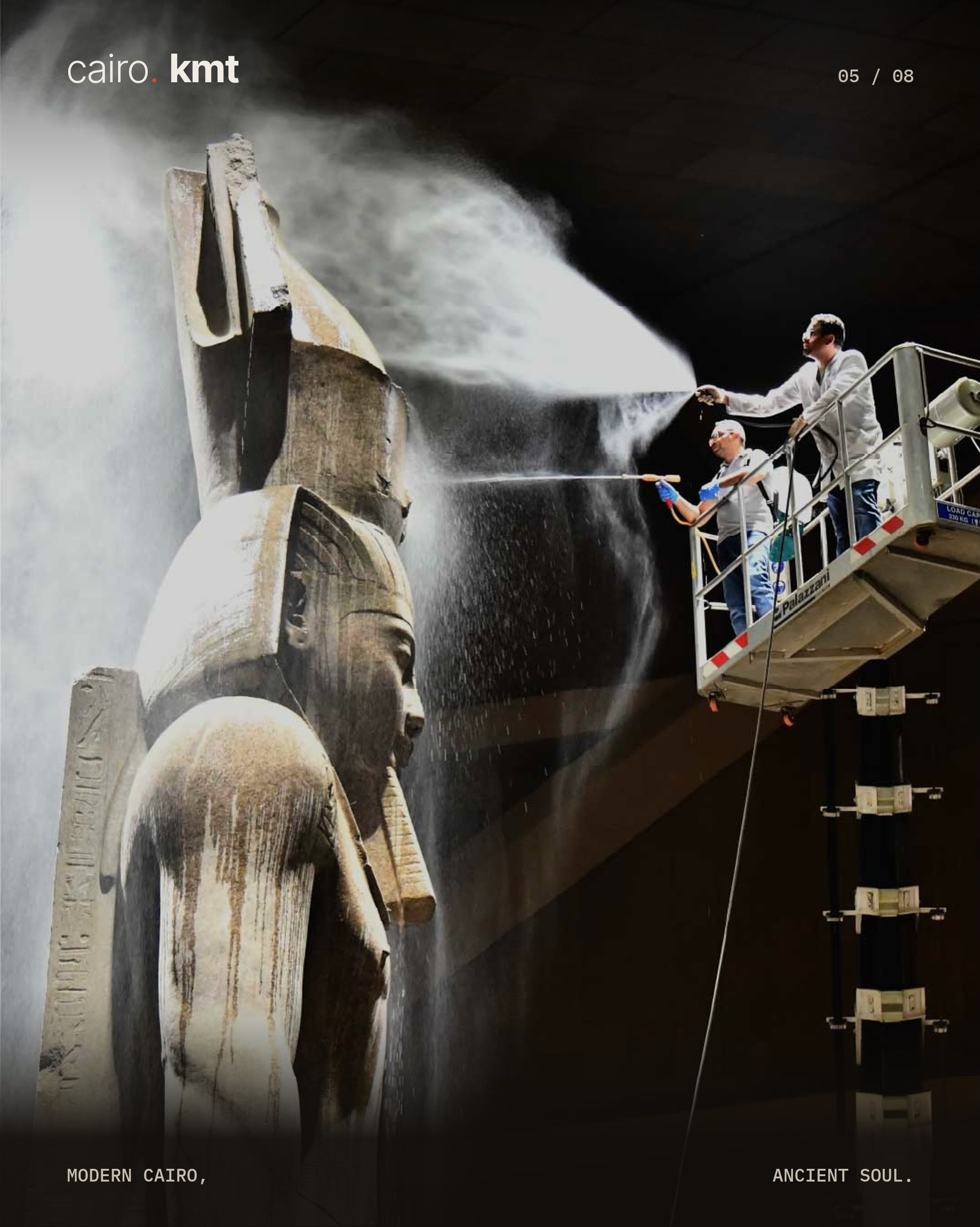 A conservator cleans the colossal statue of Ramesses II