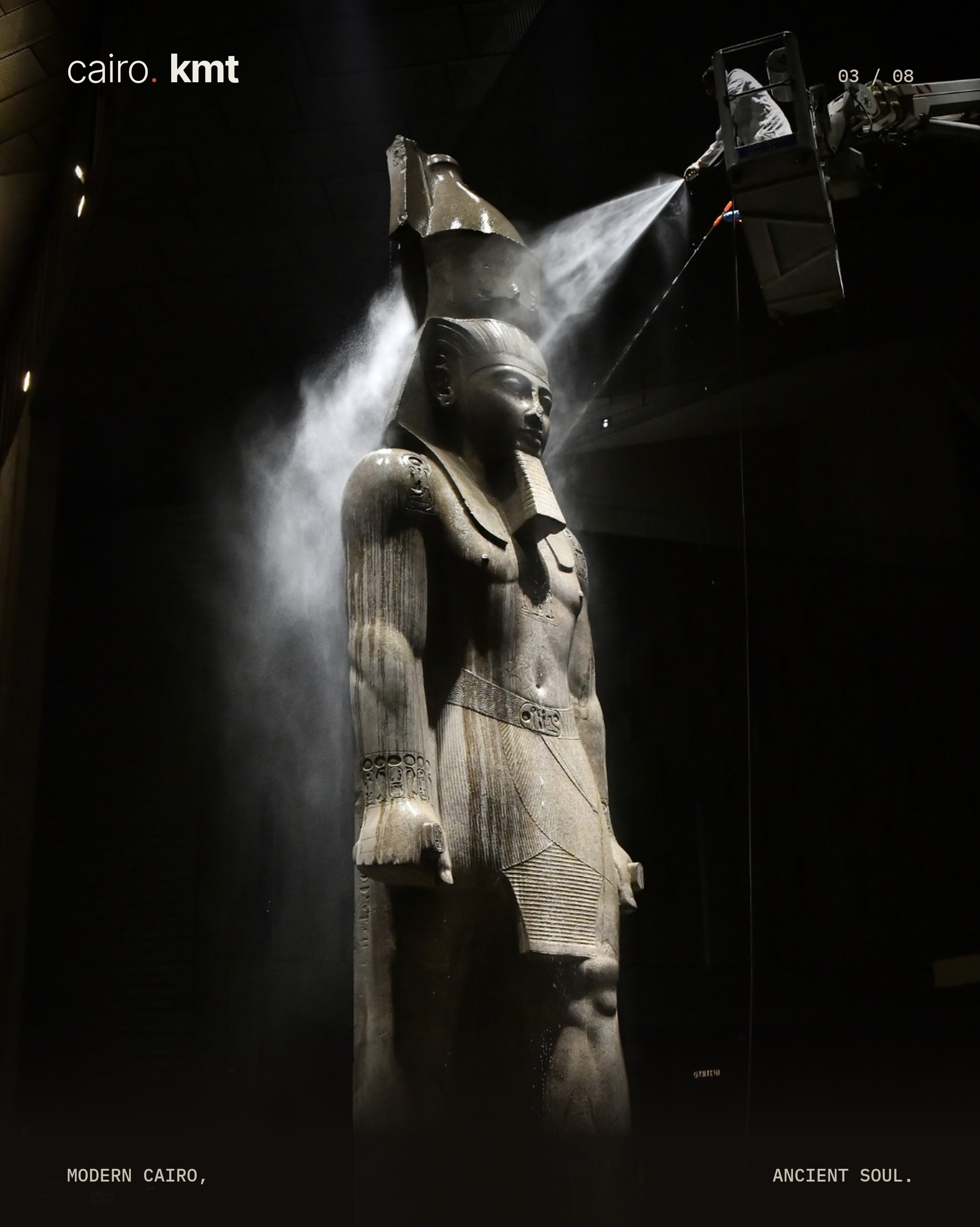 A conservator cleans the colossal statue of Ramesses II
