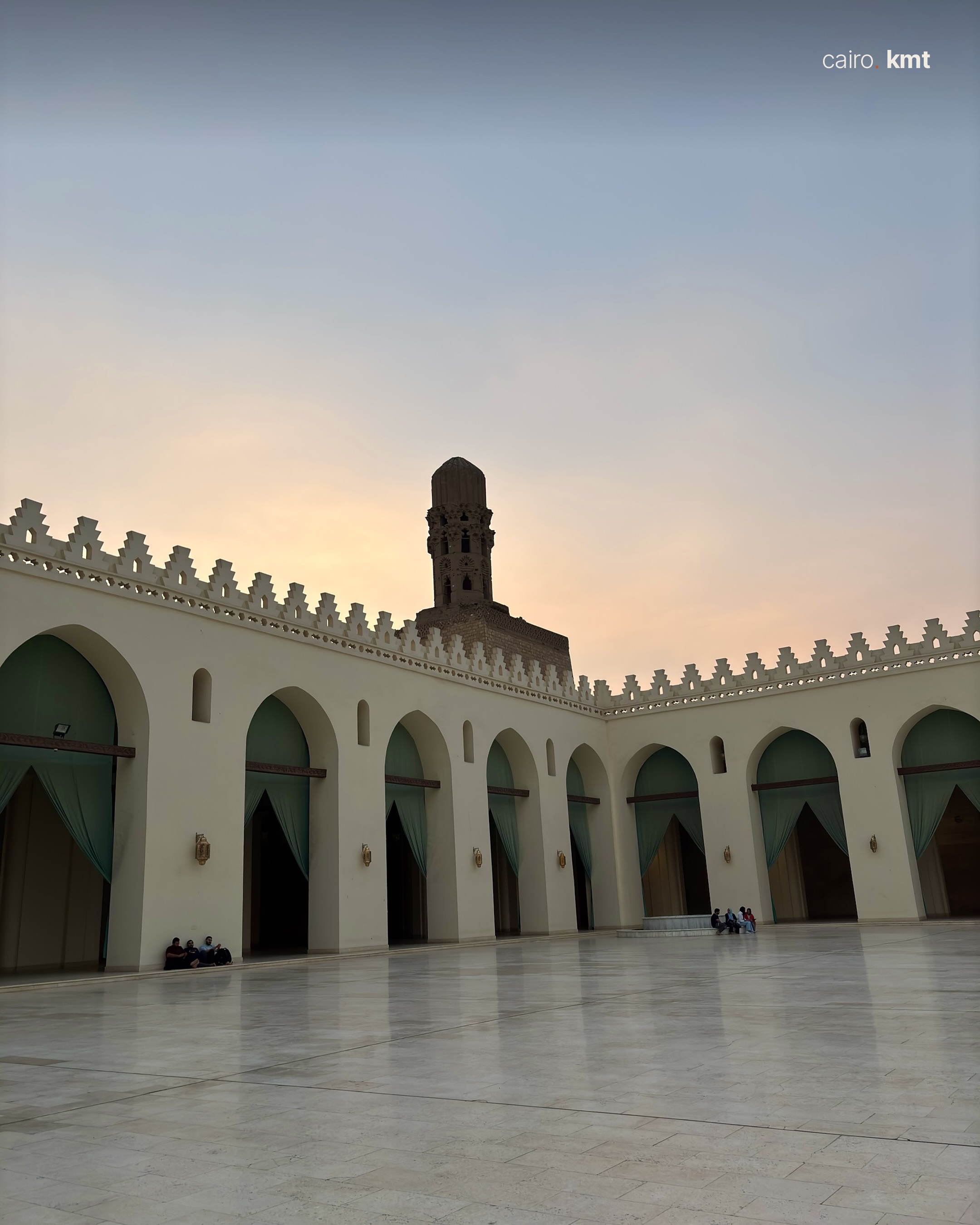 The courtyard of the Mosque of al-Hakim seen through green curtains