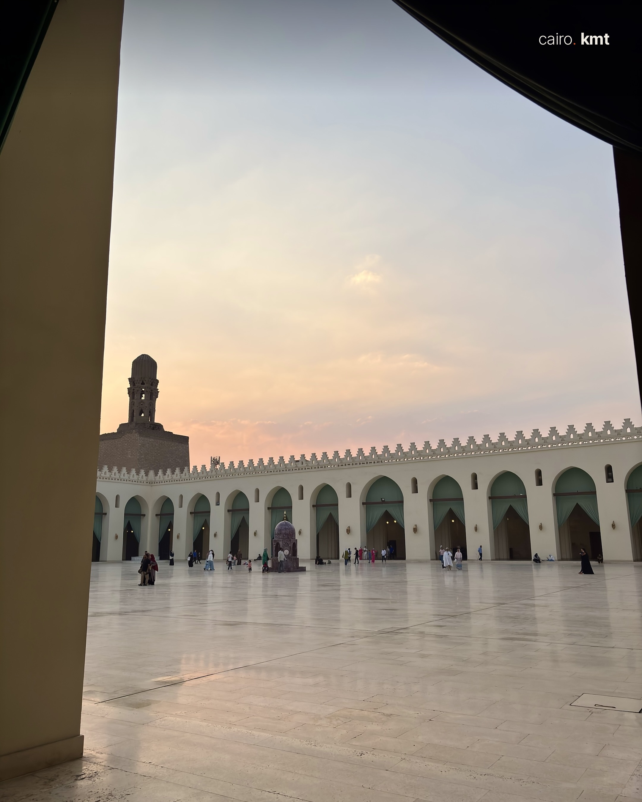 The courtyard of the Mosque of al-Hakim seen through green curtains